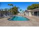 Private in-ground pool with brick patio, sun loungers and tropical landscaping at 7901 Willow Brook Ct, Hudson, FL 34667