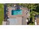 Aerial view of a refreshing backyard swimming pool with patio furniture at 7901 Willow Brook Ct, Hudson, FL 34667