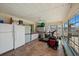 Enclosed sunroom with tile flooring, a ceiling fan, and multiple windows that provide lots of natural light at 7901 Willow Brook Ct, Hudson, FL 34667