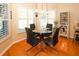 Dining area with modern table, chairs and natural light at 8609 Regal Ln, Hudson, FL 34667