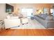 Bright living room with hardwood floors and comfortable seating area at 8609 Regal Ln, Hudson, FL 34667
