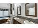 Bathroom featuring double sinks with granite countertop, soaking tub, and a beautifully tiled shower at 9896 Scepter Ave, Brooksville, FL 34613