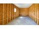 Interior of an unfinished garage, ready for customization with concrete floor and stud walls at 9896 Scepter Ave, Brooksville, FL 34613