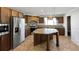 Bright kitchen with a granite island, stainless steel appliances, ample storage, and tile floors at 9896 Scepter Ave, Brooksville, FL 34613