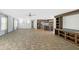 Expansive living room with tile flooring adjacent to kitchen for modern living and entertaining at 9896 Scepter Ave, Brooksville, FL 34613