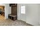 Mudroom featuring tile floors, custom cabinet, and door with a window at 9896 Scepter Ave, Brooksville, FL 34613