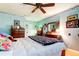 Bright bedroom with a ceiling fan and views of a large closet at 9925 Whitworth Ct, New Port Richey, FL 34655
