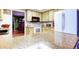 Bright kitchen featuring wood cabinets, white appliances, and ample countertop space at 9925 Whitworth Ct, New Port Richey, FL 34655