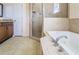 Well lit bathroom features a soaking tub, shower and vanity with drawers at 10056 Lebanon Dr, Port Charlotte, FL 33981