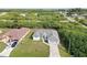 Charming single-Gathering home featuring well-maintained landscaping and a spacious driveway at 10056 Lebanon Dr, Port Charlotte, FL 33981