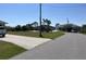 Street view showcasing a well-maintained neighborhood and inviting curb appeal at 10056 Lebanon Dr, Port Charlotte, FL 33981
