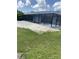 Long screened-in pool with a covered patio area at 10056 Lebanon Dr, Port Charlotte, FL 33981