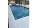 Sparkling pool with clean, modern, white trim and serene atmosphere at 10056 Lebanon Dr, Port Charlotte, FL 33981