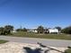 A partially cleared vacant lot on a sunny day; ready to build a custom home at 10056 Lebanon Dr, Port Charlotte, FL 33981