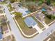 Aerial view of house and neighborhood with a pond nearby, perfect for nature lovers at 10114 Briar Cir, Hudson, FL 34667