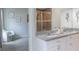 Modern bathroom featuring granite countertops, dual sinks, and a glass-enclosed shower at 10114 Briar Cir, Hudson, FL 34667