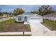 Charming single-story home features a two-car garage and landscaped front yard at 10114 Briar Cir, Hudson, FL 34667