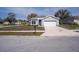 Charming single-story home with a well-manicured lawn and a two-car garage at 10114 Briar Cir, Hudson, FL 34667