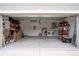 Garage featuring plenty of storage racks, and side-by-side laundry machines at 10114 Briar Cir, Hudson, FL 34667