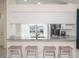 Granite kitchen bar with seating, perfect for casual dining and entertaining at 10114 Briar Cir, Hudson, FL 34667