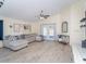 Spacious living room with hardwood floors and a comfortable couch at 10114 Briar Cir, Hudson, FL 34667