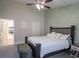 Bedroom suite with a neutral decor, complemented by soft textures and light fixtures at 10114 Briar Cir, Hudson, FL 34667