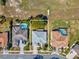 Aerial view shows a single-Gathering home with lush surroundings near neighboring homes at 10285 Velvetseed Cir, Spring Hill, FL 34608