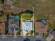 Aerial view shows a single-Gathering home with lush surroundings near neighboring homes at 10285 Velvetseed Cir, Spring Hill, FL 34608