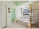 Bathroom boasts soaking tub, glass shower, and private toilet area at 10285 Velvetseed Cir, Spring Hill, FL 34608