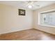 Bedroom with hardwood floors, a ceiling fan and natural light at 10285 Velvetseed Cir, Spring Hill, FL 34608