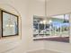 Bright breakfast nook with large window and view of lanai at 10285 Velvetseed Cir, Spring Hill, FL 34608