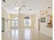 Spacious living area with tiled flooring, light walls, and natural light at 10285 Velvetseed Cir, Spring Hill, FL 34608