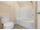 Full bathroom features a shower-tub combination at 10322 Elnora St, Spring Hill, FL 34608