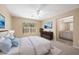 Bright main bedroom boasts plush carpets and a ensuite bathroom with double sinks at 10322 Elnora St, Spring Hill, FL 34608