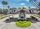 Elegant 24-hour guard house with manicured landscaping and visitor clearance at 11545 Weaver Park Ct, Trinity, FL 34655