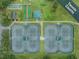 Aerial view of the tennis courts and amenities, showcasing the recreational opportunities available in the community at 11545 Weaver Park Ct, Trinity, FL 34655