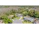 Expansive aerial view of a suburban home on a large lot with mature trees and landscaping at 12215 Snead Pl, Tampa, FL 33624