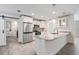 Modern kitchen with granite countertops, stainless steel appliances, and ample storage space at 12215 Snead Pl, Tampa, FL 33624