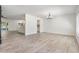 Open-concept living space with wood-look floors at 12215 Snead Pl, Tampa, FL 33624