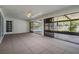 Covered patio featuring tile flooring with access to the pool area through sliding glass doors at 12215 Snead Pl, Tampa, FL 33624