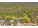 Aerial view showing the house adjacent to a common green space with walking trails at 12446 Quail Ridge Dr, Spring Hill, FL 34610