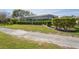 Lovely home featuring a screened-in porch overlooking the well-manicured backyard at 12446 Quail Ridge Dr, Spring Hill, FL 34610