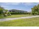 Spacious, well-maintained backyard with beautiful greenery and screened-in porch at 12446 Quail Ridge Dr, Spring Hill, FL 34610