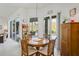 Cozy breakfast nook provides a pleasant dining area with view of the screened lanai and pool at 12446 Quail Ridge Dr, Spring Hill, FL 34610