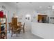 Bright breakfast nook adjacent to the kitchen has a table and chairs for dining at 12446 Quail Ridge Dr, Spring Hill, FL 34610