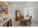 Bright dining room with tile floors, large window, and wood dining set, great for Gathering gatherings at 12446 Quail Ridge Dr, Spring Hill, FL 34610
