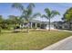 Charming single-Gathering home with mature palm trees and manicured lawn at 12446 Quail Ridge Dr, Spring Hill, FL 34610