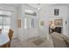 Inviting foyer featuring decorative glass door, transom window, and access to dining and sitting areas at 12446 Quail Ridge Dr, Spring Hill, FL 34610