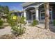 Home features a charming entrance, pillars, and mature landscaping at 12446 Quail Ridge Dr, Spring Hill, FL 34610