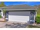 Close up of the garage of this single-Gathering home with nice architectural features at 12446 Quail Ridge Dr, Spring Hill, FL 34610